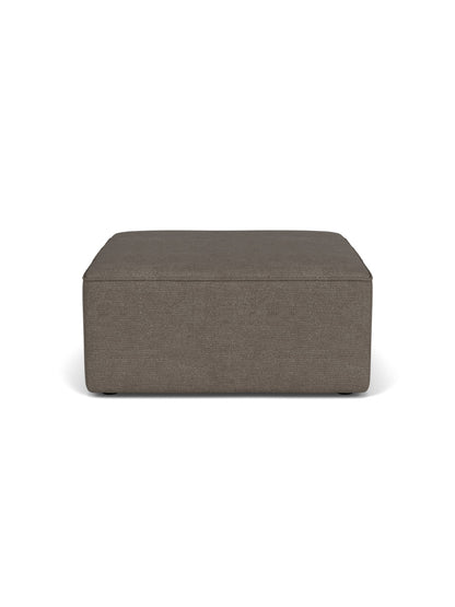 A front-on view of the Eave Sectional Pouf, a rectangular ottoman upholstered in a dark taupe bouclé fabric.