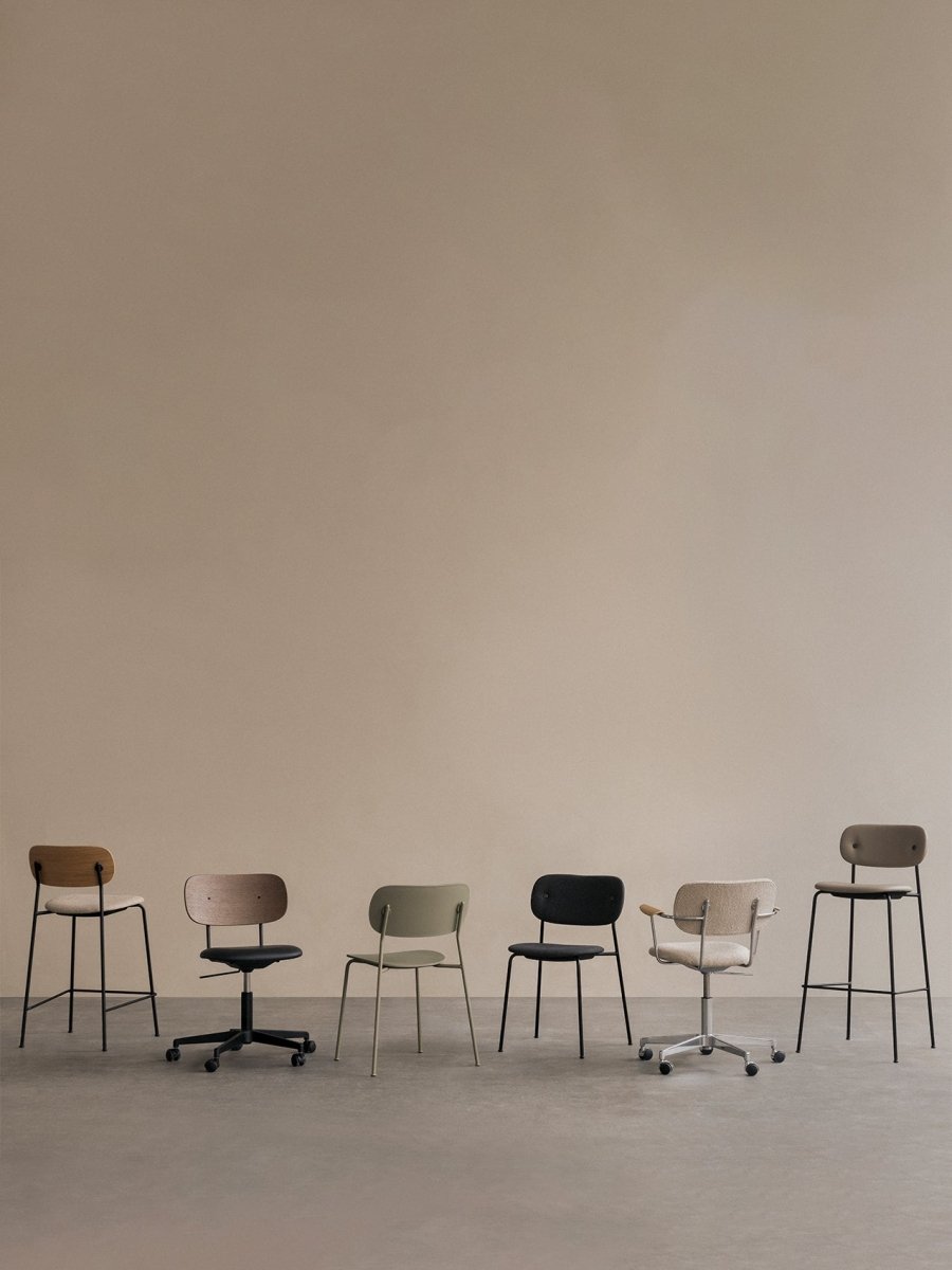 Co Task Chairs, Dining Chairs and Bar Counter Chairs in a row with wood, metal and muted beige, olive and black upholstery.