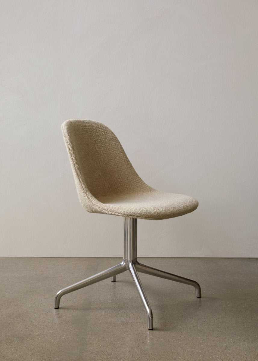 Beige Audo Bouclé Harbour Side Chair featuring a polished aluminum star base, presented in a minimalist interior.