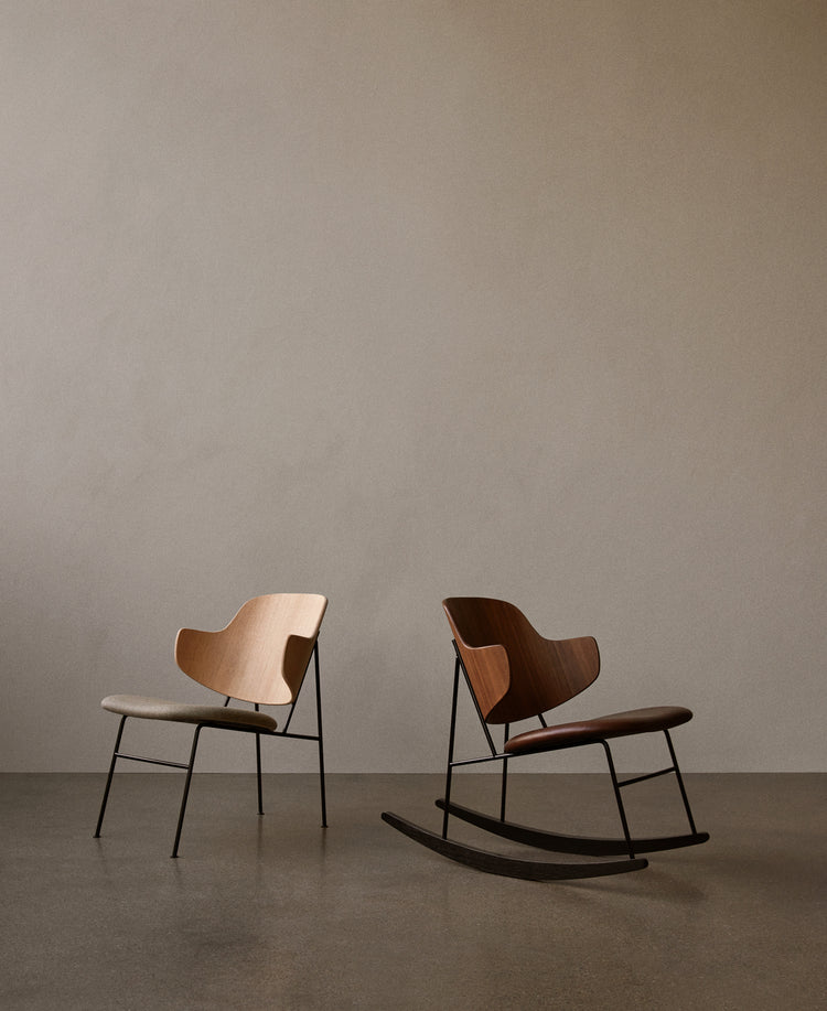 Pair of minimalist lounge chairs: one beige wood seat with fabric cushion, one walnut rocking chair with leather seat and