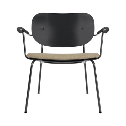 Co Lounge Chair, Partially Upholstered, in black oak and beige Audo Bouclé 02 on a black steel frame, front view.