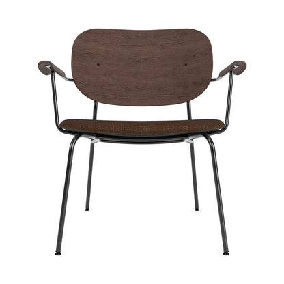 Co Lounge Chair featuring a dark stained oak backrest, brown Bouclé 07 upholstered seat, and black steel frame.