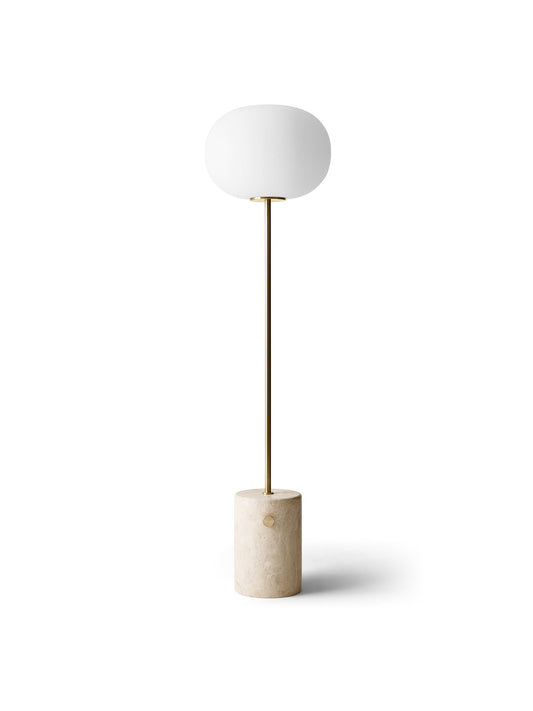 Front view of the JWDA Floor Lamp with a travertine stone base, a brushed brass stem, and an elliptical opal glass shade.