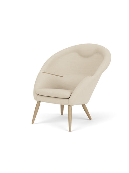 Oda Lounge Chair in textured light cream Hallingdal 65 fabric with natural oak legs and armrest details.