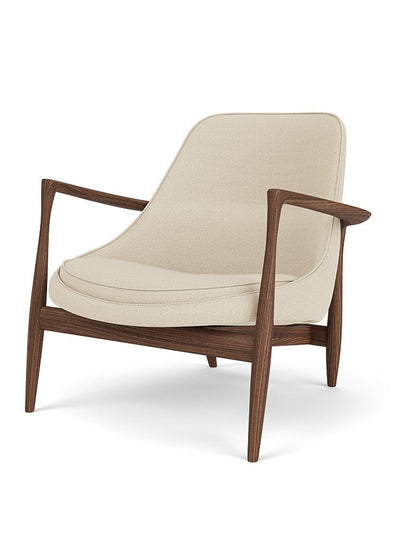 An Elizabeth Lounge Chair with a dark walnut frame and cream Hallingdal upholstery, shown angled on a white background.