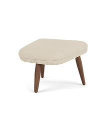 Oda Ottoman with a rounded rectangular top in light beige fabric, on four angled, tapered dark walnut legs.