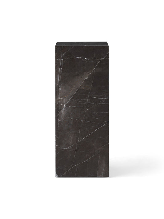 A front-on studio shot of the Plinth Pedestal in Grey Kendzo marble, a dark gray rectangular block with dramatic white veins.