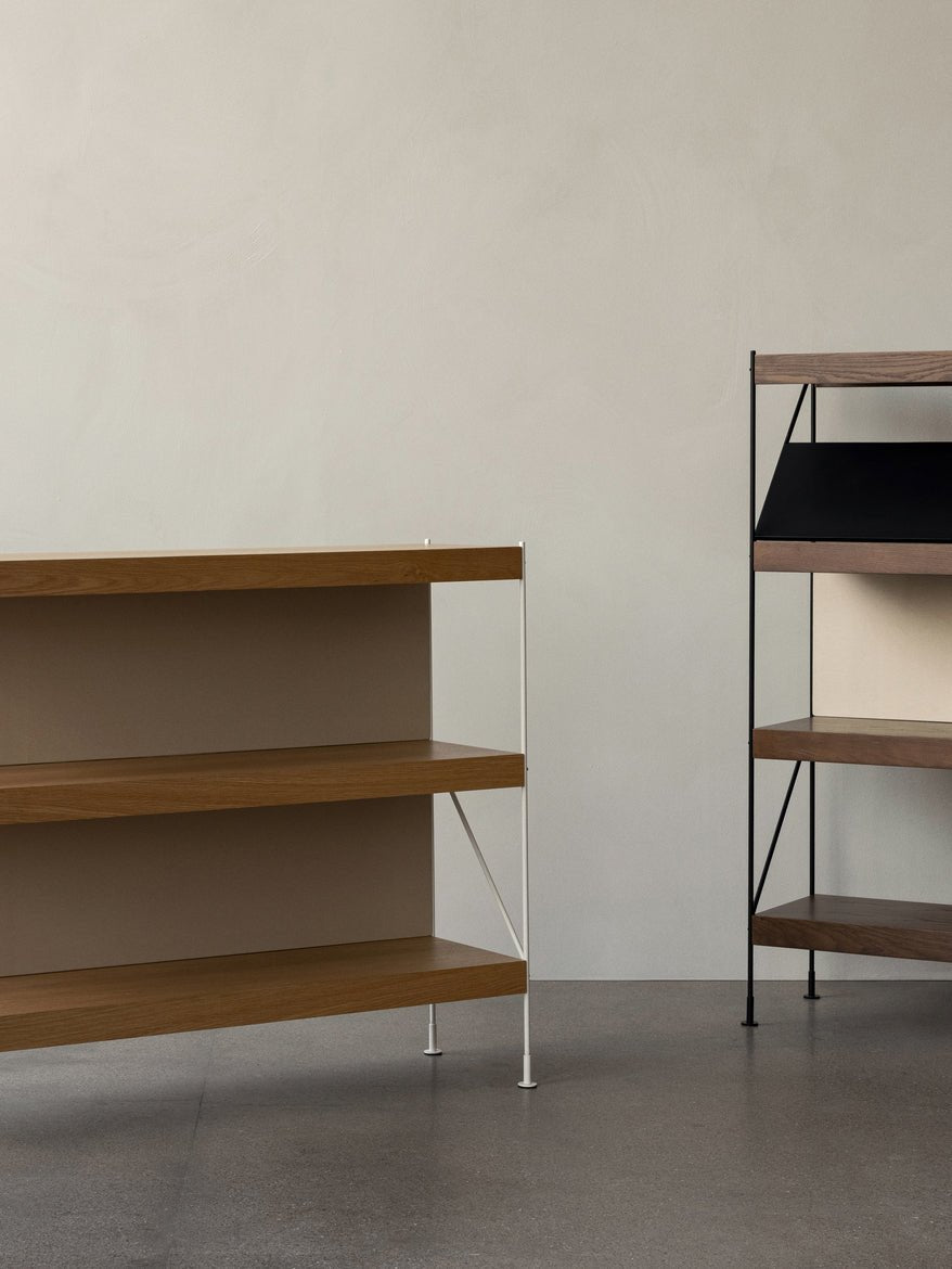 Zet Storage System: A natural oak unit with ivory frame beside a dark oak version with black frame and magazine shelf.